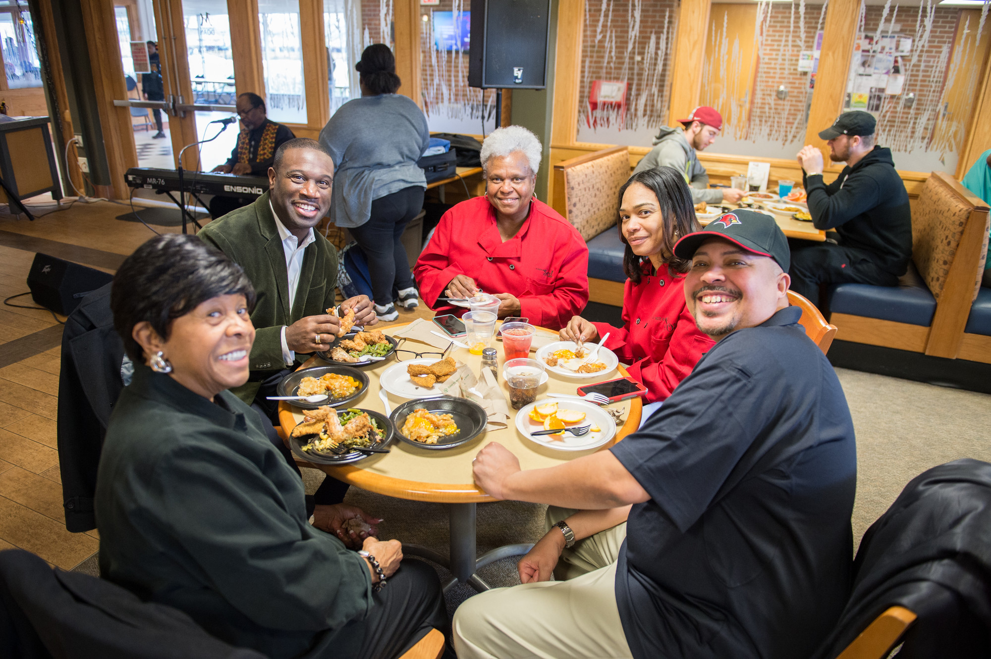 people around round table enjoying soul food